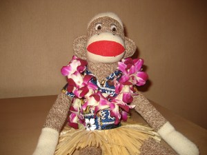 Steve kicks back at a luau and sips some "pineapple juice."