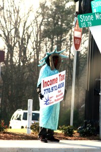 The Statue of LIbertry wearing a fur-lined hood is creepy enough. In my town where it's been warm the last few days, one Mr. Liberty has been wearing shorts under his robe. I hope.  photo credit: Income tax of liberty via photopin (license)